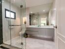 Modern bathroom with glass shower and double sink