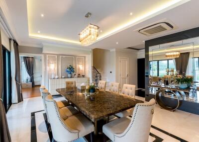 Elegant dining area with a luxurious chandelier and large dining table