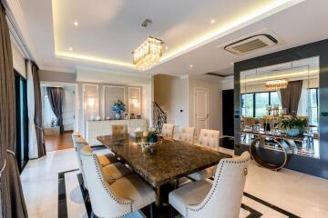 Elegant dining area with a luxurious chandelier and large dining table