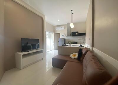 Modern living room with open kitchen and sofa