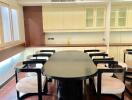 Modern dining room with dark table and cushioned chairs