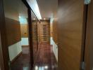 Hallway with wooden doors and mirrored closet