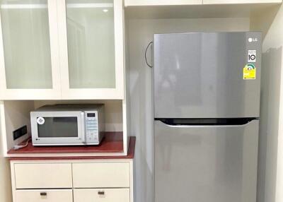 Modern kitchen with microwave and refrigerator