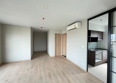 Spacious main living area with adjacent kitchen