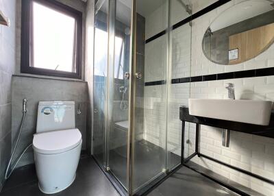 Modern bathroom with glass shower and sleek fixtures