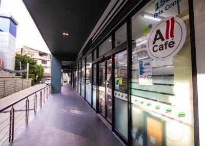 Exterior view of a commercial building with multiple shop fronts