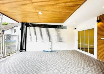 Covered spacious outdoor area with tiled flooring