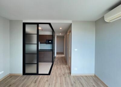 Modern living area with view into kitchen