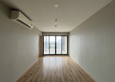 Spacious living room with large windows