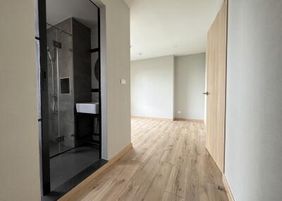 Hallway leading to a bathroom and a bedroom