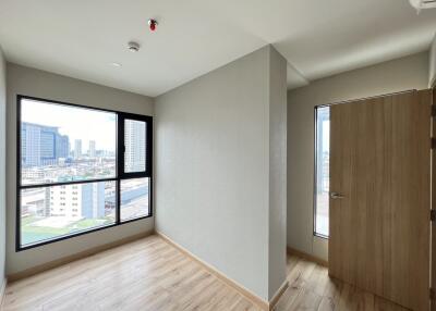 modern bedroom with large windows and city view