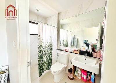 Modern bathroom with shower, toilet, and sink