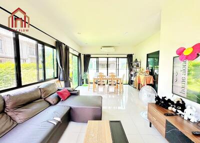 Spacious living room with large windows and modern decor