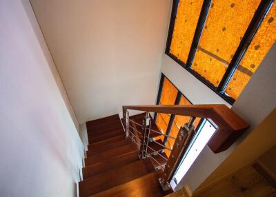 Wooden staircase with large windows