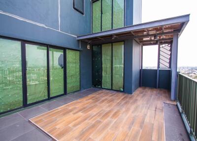 Spacious balcony with sliding glass doors and a view