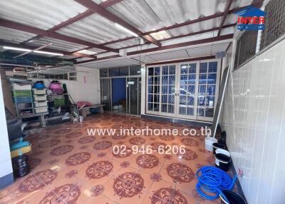 Covered outdoor area with storage and tiled floor