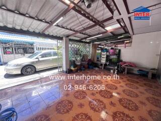 Garage space with tiled floor and storage area