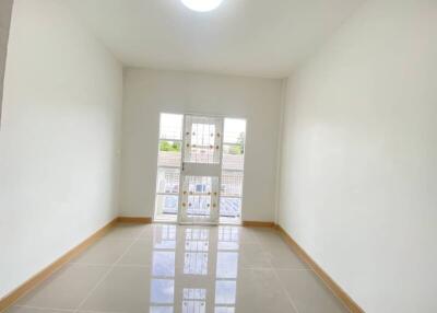 Bright, empty room with large window