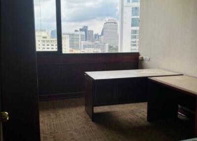 Small office space with large window and city view