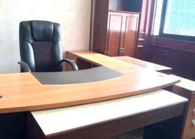 Modern office space with executive desk and chair