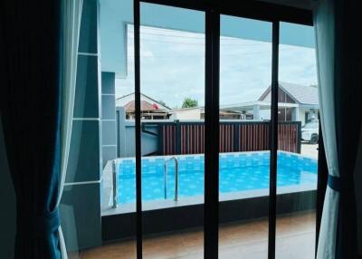 Living room with view of the swimming pool