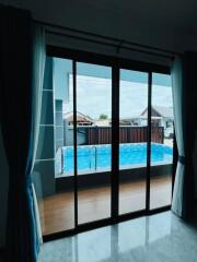 Living room with view of the swimming pool