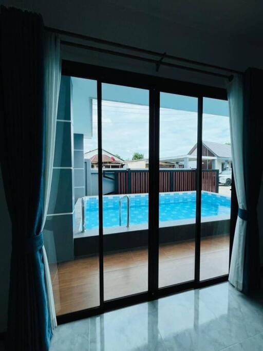 Living room with view of the swimming pool