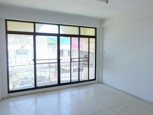 Empty living room with large window