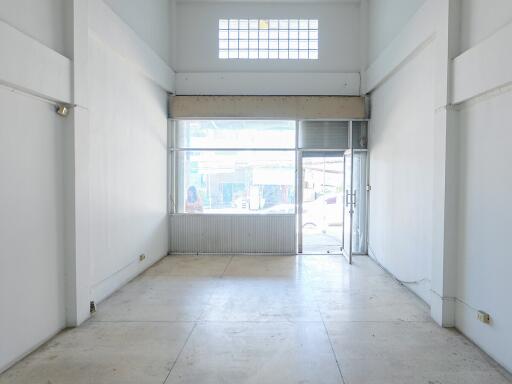 Empty commercial space with large front windows