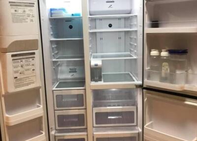 Open refrigerator showing compartments and shelves