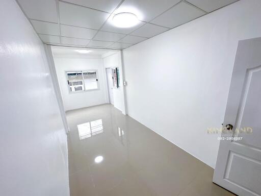 Bright empty room with tile flooring and window