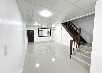 Minimalist living room with staircase