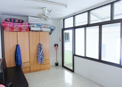 Bedroom with wardrobe and large windows