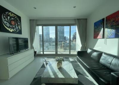 Modern living room with a large window and city view