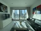 Modern living room with a large window and city view