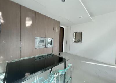 Modern kitchen with glass table and built-in appliances