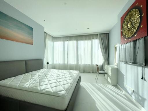 Bright and airy bedroom with a large bed and modern decor