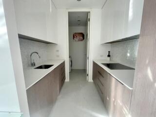 Modern galley kitchen with white and wooden cabinets