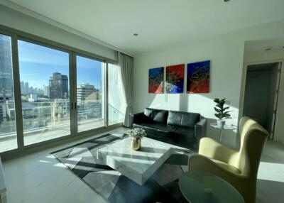 Modern living room with large windows and city view