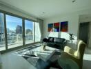 Modern living room with large windows and city view