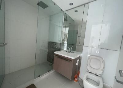 Modern bathroom with glass shower and floating vanity