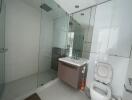 Modern bathroom with glass shower and floating vanity