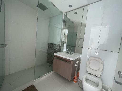 Modern bathroom with glass shower and floating vanity