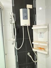 Bathroom with water heater and shower