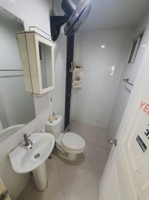 A small clean bathroom with basic amenities