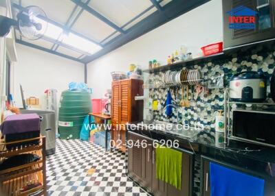 Modern kitchen with checkerboard floor and wall-mounted storage