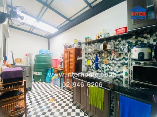 Modern kitchen with checkerboard floor and wall-mounted storage