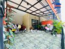 Patio area with tiled flooring and various plants