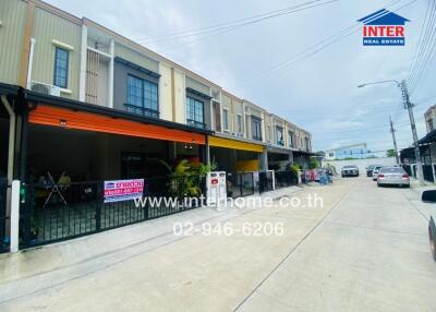 Street view of row houses with garages