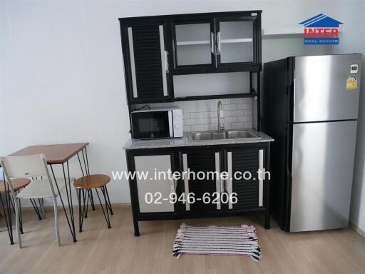 Modern kitchen with appliances and dining area